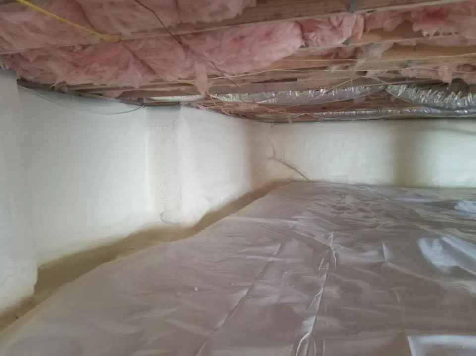 Crawl space encapsulation with closed-cell spray foam for Storm Damage Roof Repair in Martins Ferry